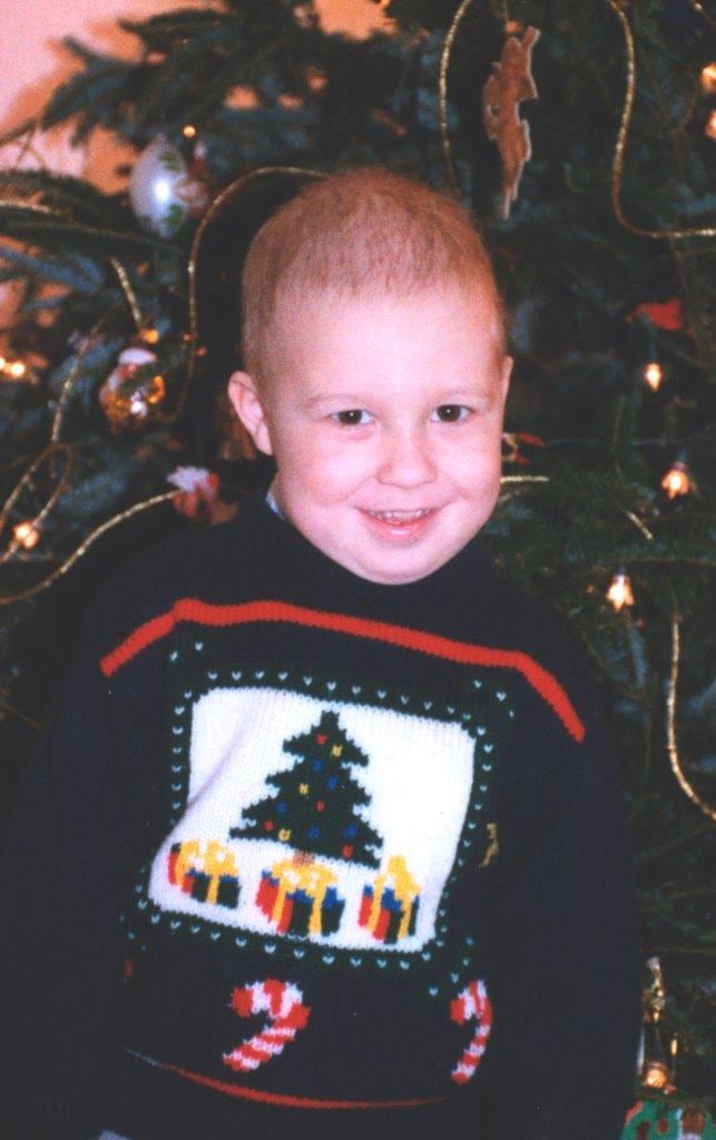 Adam as a child during his leukemia treatment